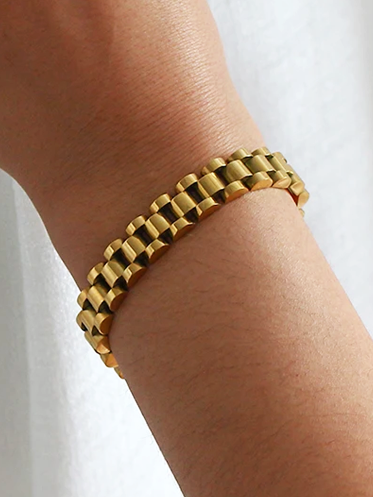 CALORA_ Brede Schakelarmband Goud van RVS