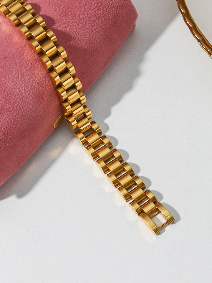 CALORA_ Brede Schakelarmband Goud van RVS