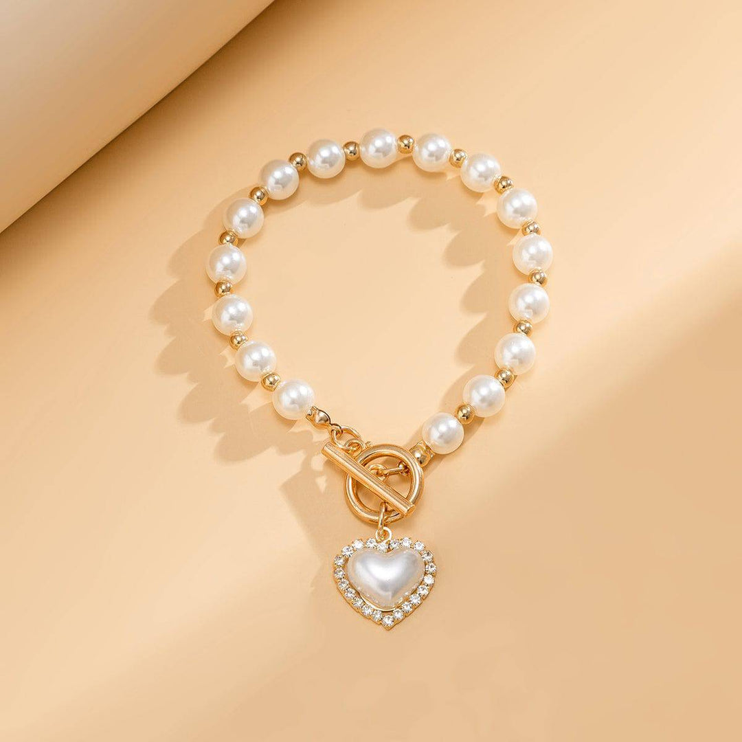 CALORA_ Elegante Zoetwaterparel Armband met Gouden Accenten