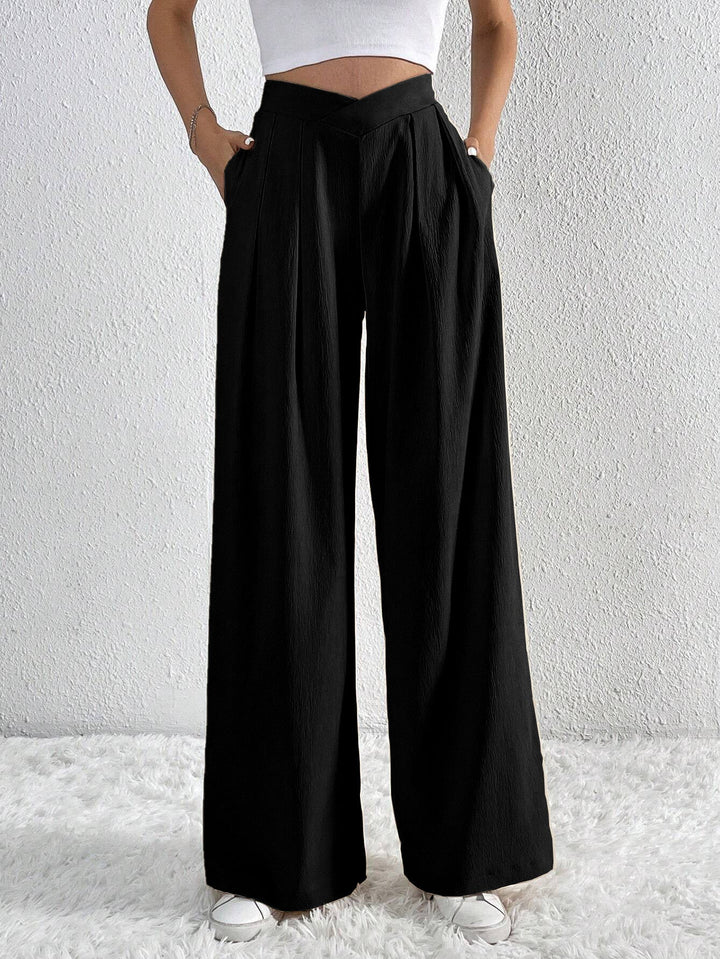 CALORA_ Wijde broek met zakken en hoge taille