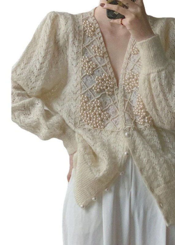 Losse beige V-hals cardigan vest van dikke gebreide stof, lange mouwen